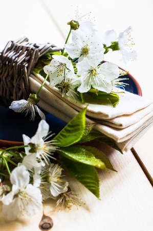 Spring time table setting with rustic plates and cherry blossomの写真素材