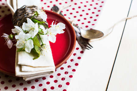 Spring time table setting with rustic plates and cherry blossomの写真素材