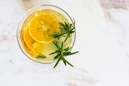 Lemon, rosemary and other and herbs detox drink on rustic backgroundの写真素材