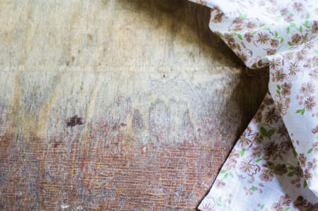 Kitchen towel or napkin over the rustic wooden table. View from above with copy spaceの写真素材