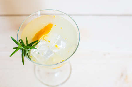 Lemon, rosemary and other and herbs detox drink on rustic backgroundの写真素材