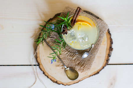 Lemon, rosemary and other and herbs detox drink on rustic backgroundの写真素材