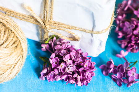 Lilac Bouquet and gift box on rustic wooden backgroundの写真素材