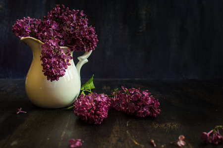 Beautiful springtime flowers of lilac on rustic wooden backgroundの写真素材