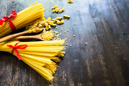 Pasta collection on rustic wooden backgroundの写真素材