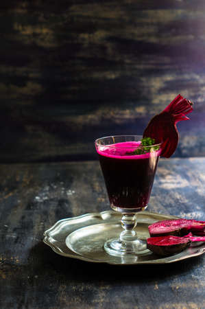 Detox smoothie drink of organic beet vegetable on rustic wooden table