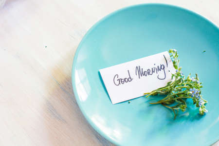 Vintage table setting with forget-me-not lowers on rustic interiorの写真素材