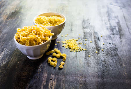 Pasta collection on rustic wooden backgroundの写真素材