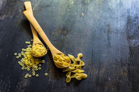 Pasta collection on rustic wooden backgroundの写真素材