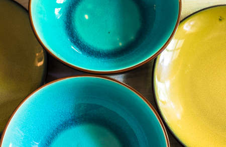 Blue and yellow plates on rustic table