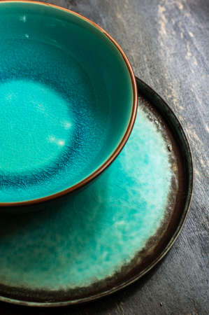 Rustic table setting with vintage silverware ad plates on old styled napkinsの写真素材