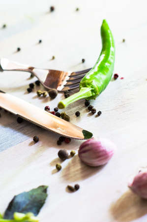 Cooking concept with fresh and organic vegetables like a chili peppers, parsley, garlic and pepper...