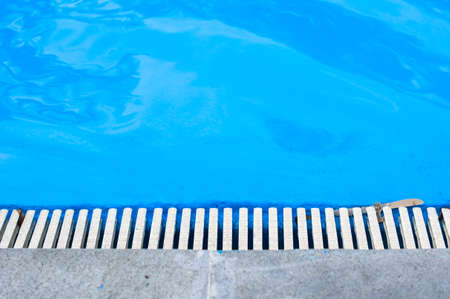 Outdoor pool with bright blue waterの写真素材