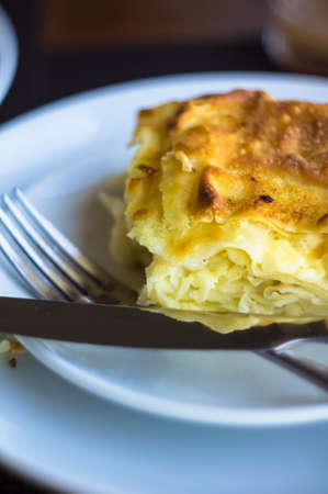 One of the georgian khachapuri type - achma, on the white plateの写真素材