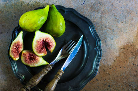 Ripe fig fruits on the stone rustic tableの写真素材