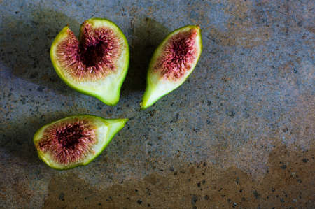 Ripe fig fruits on the stone rustic tableの写真素材