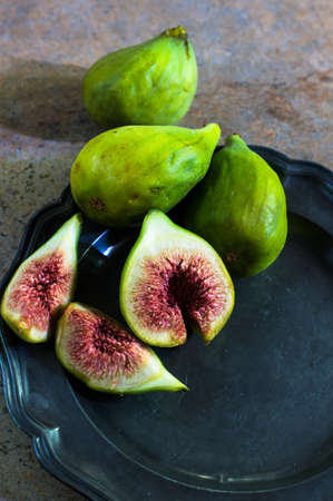 Ripe fig fruits on the stone rustic tableの写真素材