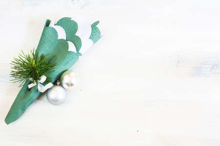 Christmas time table setting with vintage silverware on plate and napkinの写真素材