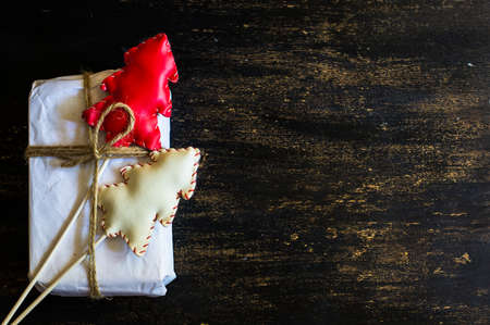Christmas presents in rustic style with holiday decorations, selective focus