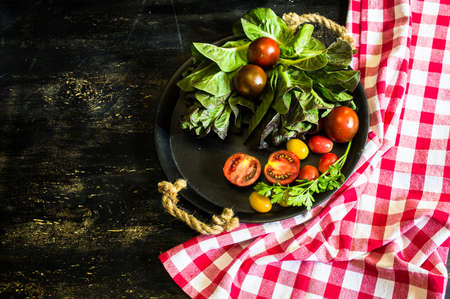 Ingredients for summer salad - romano salad, tomatoes, parsley etc.の写真素材