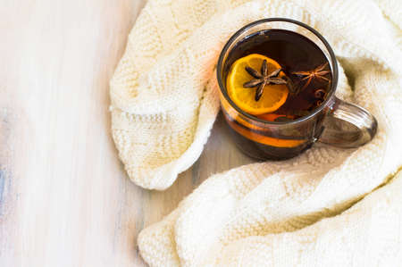 Christmas tine tea with lemon and spices like cinnamon sticks and anise star on rustic backgroundの写真素材
