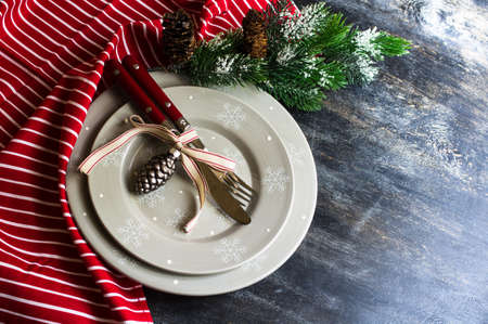 Christmas time table setting with vintage silverware on plate and napkinの写真素材