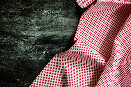 Kitchen towel or napkin over the rustic wooden table. View from above with copy space