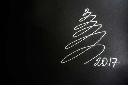 Abstract christmas tree on blackboard with chalk