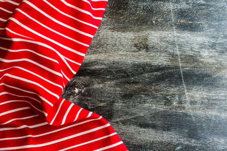 Kitchen towel or napkin over the rustic wooden table. View from above with copy spaceの写真素材