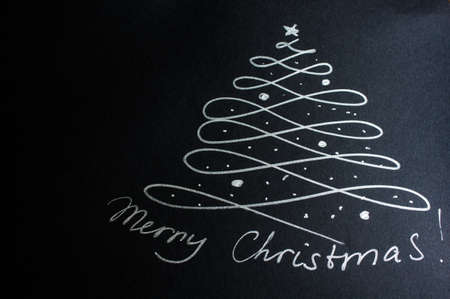 Abstract christmas tree on blackboard with chalkの写真素材