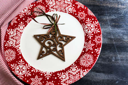 Christmas time table setting with vintage silverware on plate and napkinの写真素材