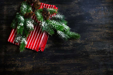 Fir tree with christmas decorations with copyspae on the rustic wooden backgroundの写真素材