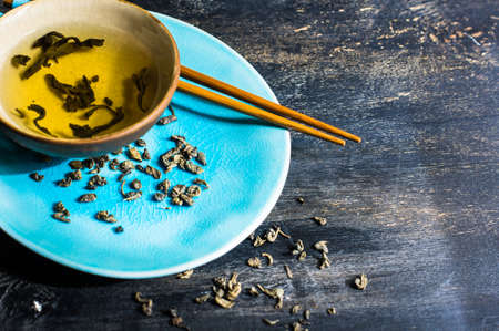 Green tea set on dark wooden rustic tableの写真素材