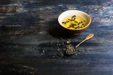 Green tea set on dark wooden rustic tableの写真素材