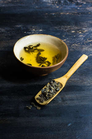 Green tea set on dark wooden rustic tableの写真素材
