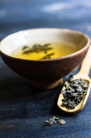 Green tea set on dark wooden rustic tableの写真素材