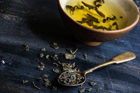 Green tea set on dark wooden rustic tableの写真素材