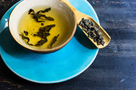 Green tea set on dark wooden rustic tableの写真素材