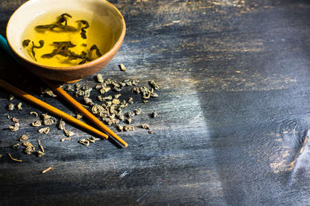 Green tea set on dark wooden rustic tableの写真素材
