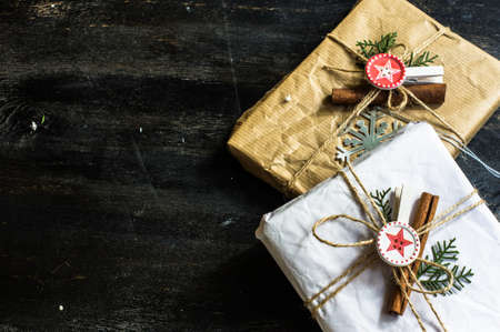 Christmas presents in rustic style with holiday decorations, selective focus