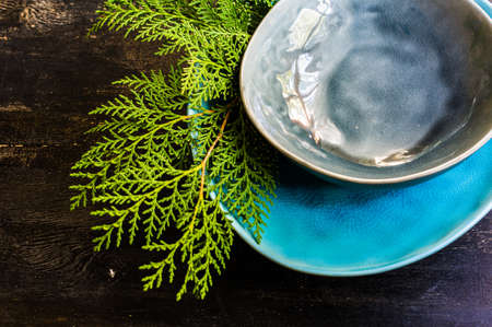 Rustic table setting for Christmas eve on rustic dark table