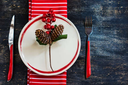 Rustic table setting for Christmas eve on rustic dark tableの写真素材
