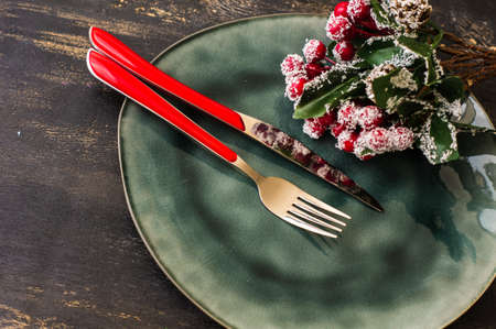 Rustic table setting for Christmas eve on rustic dark tableの写真素材