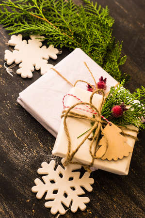 Christmas presents in rustic style with holiday decorations, selective focus
