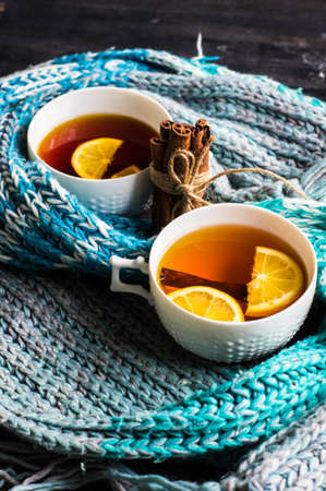 Cup of Tea with a Lemon and Cinnamon on Christmas Background. Rustic styleの写真素材