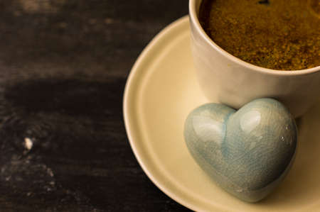 Morning cup of coffee for St. Valentines Day on dark rustic tableの写真素材