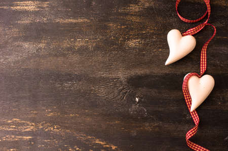St. Valentine day festive frame on dark wooden background with copyspaceの写真素材