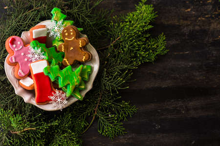 Christmas concept with gingerbread man cookie on dark wooden backgroundの写真素材