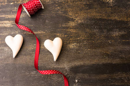 St. Valentine day festive frame on dark wooden background with copyspaceの写真素材