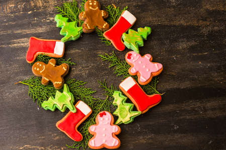 Christmas concept with gingerbread man cookie on dark wooden backgroundの写真素材